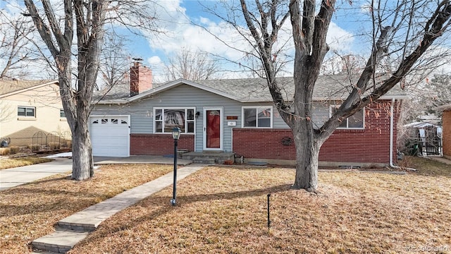 single story home with a garage and a front lawn