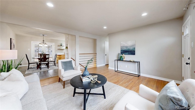 living room with light hardwood / wood-style floors