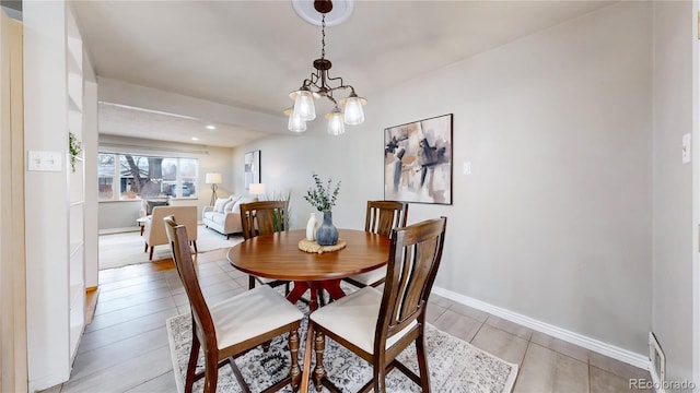 dining room with a chandelier