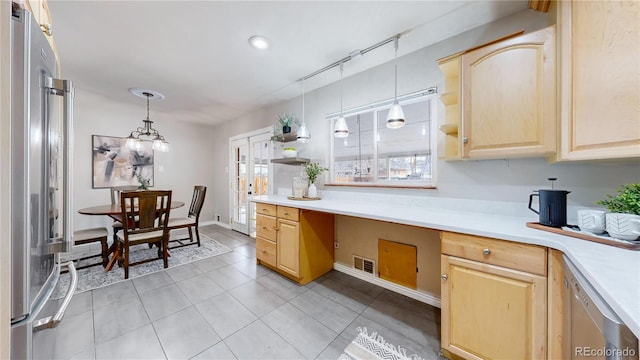 kitchen with built in desk, decorative light fixtures, light tile patterned floors, high end fridge, and light brown cabinets