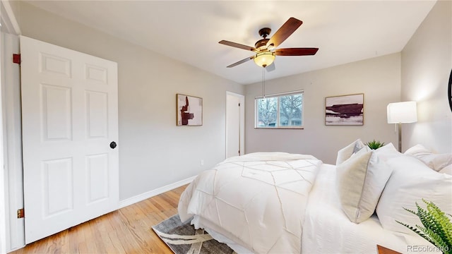 bedroom featuring light hardwood / wood-style flooring and ceiling fan