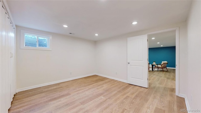 basement featuring light wood-type flooring