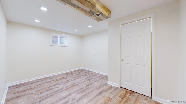 basement featuring light hardwood / wood-style flooring