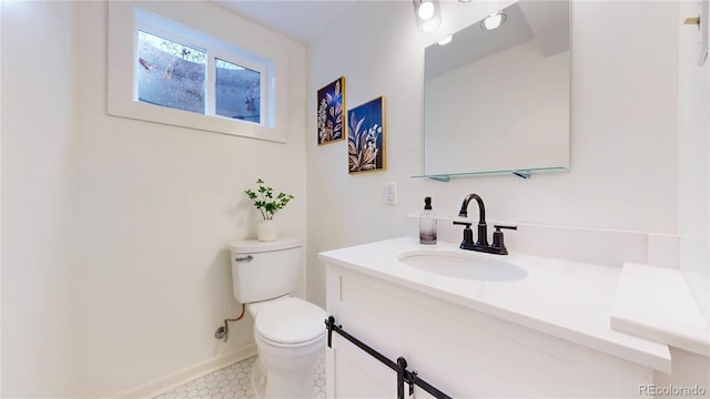 bathroom featuring vanity and toilet