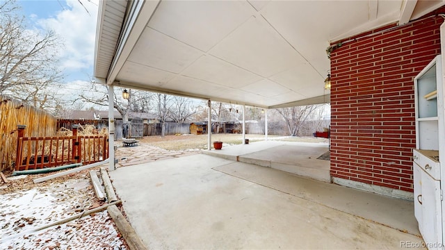 view of snow covered patio