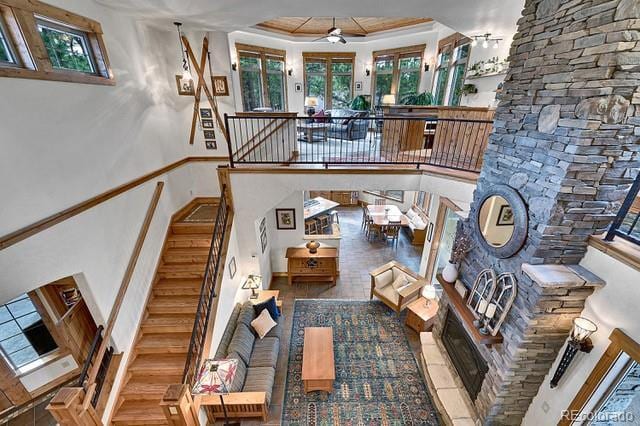 15947 Huckleberry Hts, Colorado Springs, CO 80908 - stairs featuring ornamental molding, ceiling fan, and a high ceiling