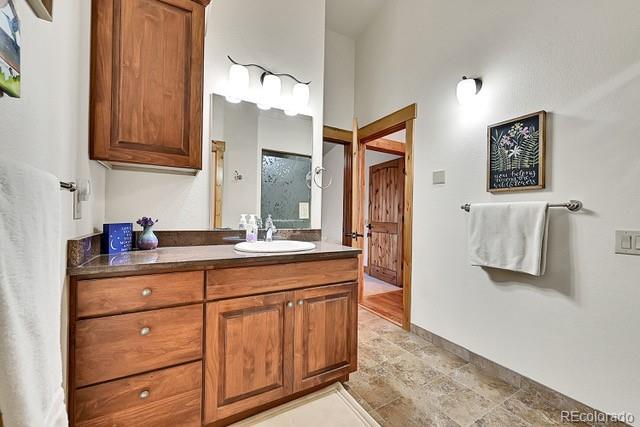 15947 Huckleberry Hts, Colorado Springs, CO 80908 - bathroom featuring vanity