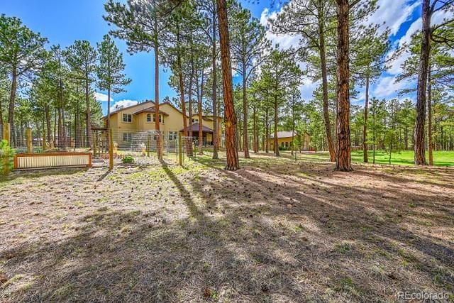 15947 Huckleberry Hts, Colorado Springs, CO 80908 - view of yard featuring fence
