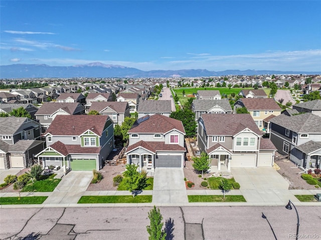 bird's eye view with a residential view and a mountain view