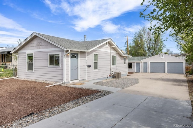 3249 W Alaska Pl, Denver, CO 80219 - ranch-style house with an outdoor structure, roof with shingles, and a garage