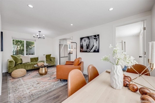 3249 W Alaska Pl, Denver, CO 80219 - living room featuring a chandelier, recessed lighting, and wood finished floors