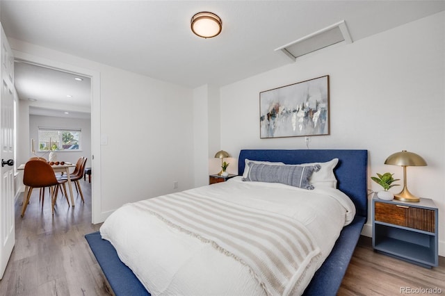 3249 W Alaska Pl, Denver, CO 80219 - bedroom featuring recessed lighting, attic access, and wood finished floors