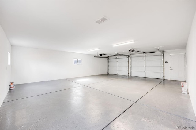 3249 W Alaska Pl, Denver, CO 80219 - garage featuring visible vents and a garage door opener
