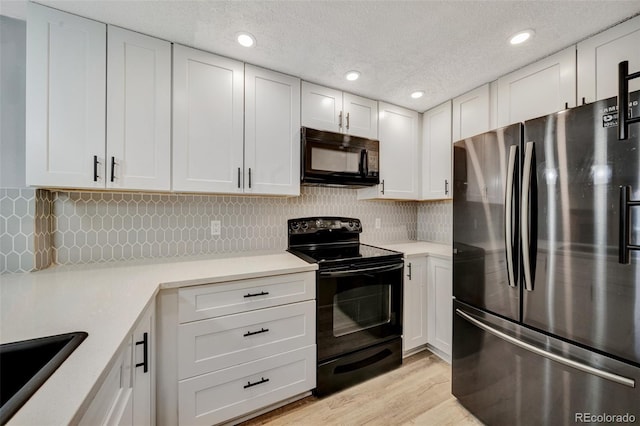 435 Dahlia St, Fort Morgan, CO 80701 - kitchen featuring black appliances, light countertops, white cabinetry, tasteful backsplash, and recessed lighting