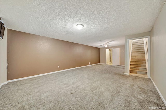 435 Dahlia St, Fort Morgan, CO 80701 - carpeted spare room with stairs, a textured ceiling, and a ceiling fan