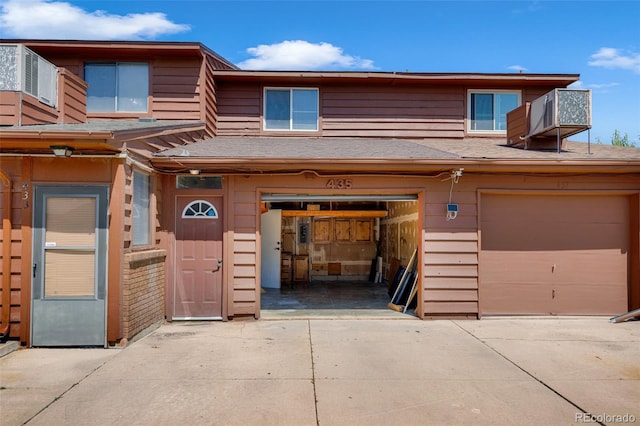 435 Dahlia St, Fort Morgan, CO 80701 - view of front of home featuring concrete driveway, roof with shingles, and an attached garage