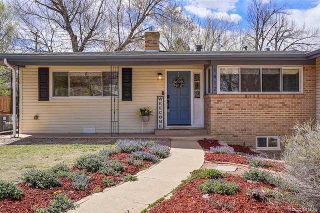 1412 Iowa, Colorado Springs, CO 80909 - view of front of property with a chimney and brick siding