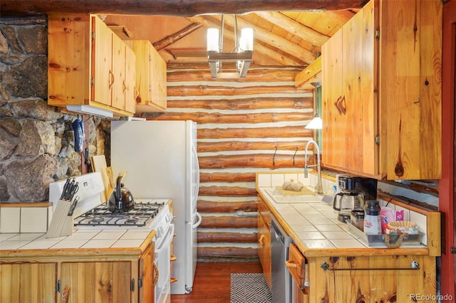 kitchen with tile countertops, hardwood / wood-style flooring, sink, white appliances, and lofted ceiling with beams