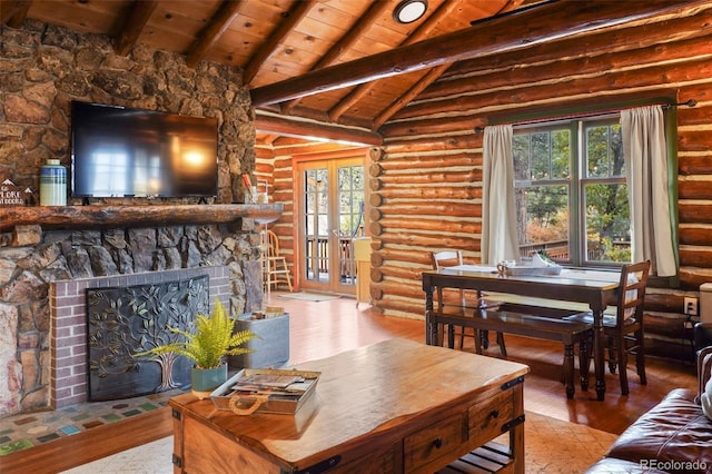 living room featuring a wealth of natural light, wood-type flooring, and a fireplace