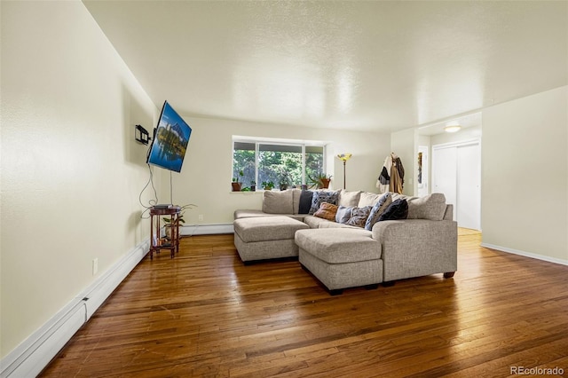 12475 W 38th Ave, Wheat Ridge, CO 80033 - living room with hardwood / wood-style floors, baseboard heating, and a baseboard radiator