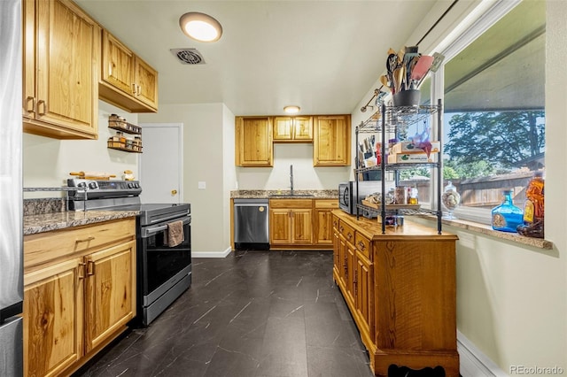 12475 W 38th Ave, Wheat Ridge, CO 80033 - kitchen with stainless steel appliances and light stone countertops