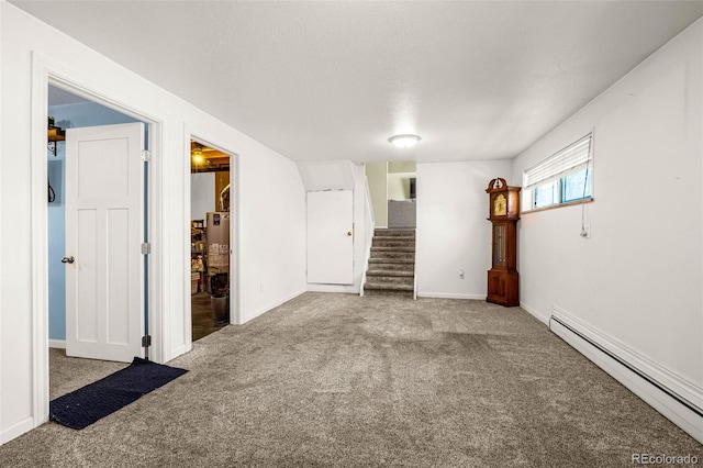 12475 W 38th Ave, Wheat Ridge, CO 80033 - empty room featuring baseboard heating, carpet, and stairway