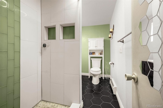12475 W 38th Ave, Wheat Ridge, CO 80033 - full bathroom with a baseboard radiator, tiled shower, and tile patterned flooring