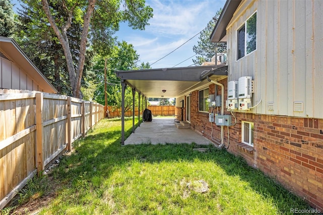 12475 W 38th Ave, Wheat Ridge, CO 80033 - fenced backyard featuring a patio area