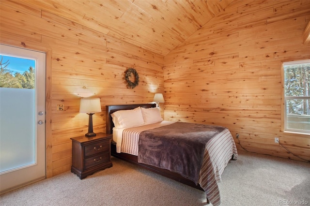 526 Wakanda Trl, Woodland Park, CO 80863 - carpeted bedroom with lofted ceiling, wooden walls, and wood ceiling