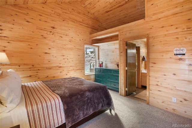 526 Wakanda Trl, Woodland Park, CO 80863 - bedroom featuring carpet, connected bathroom, wood walls, wooden ceiling, and lofted ceiling