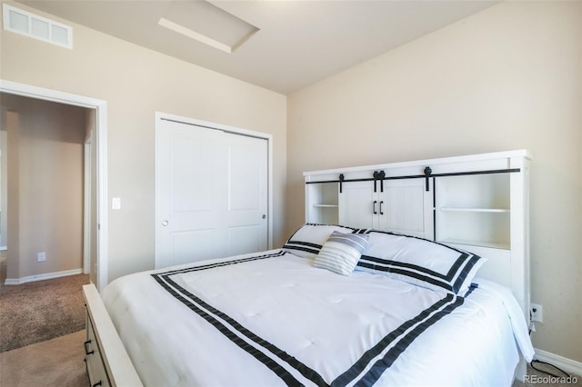 bedroom featuring visible vents, baseboards, carpet flooring, and attic access