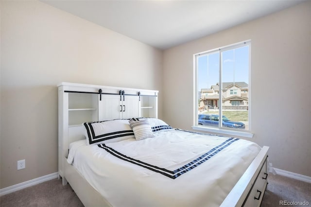 bedroom featuring baseboards and carpet flooring