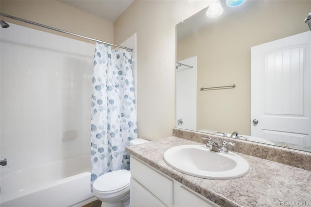 full bath featuring shower / bath combo, toilet, and vanity