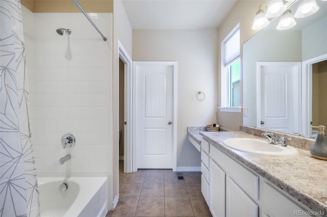 full bath with shower / tub combo, vanity, a notable chandelier, and tile patterned flooring