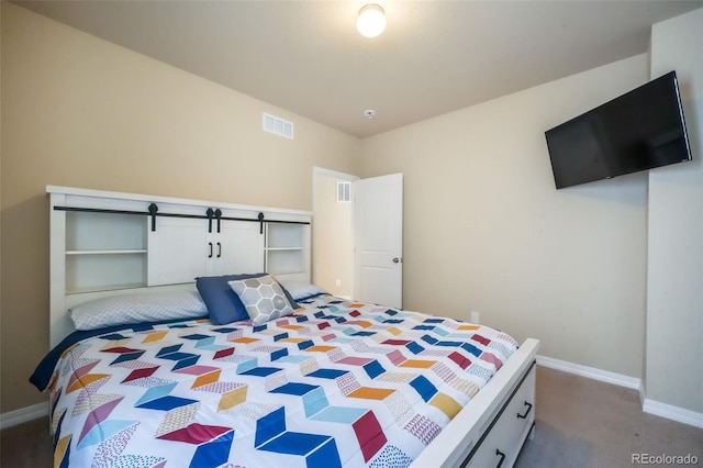 carpeted bedroom with baseboards and visible vents