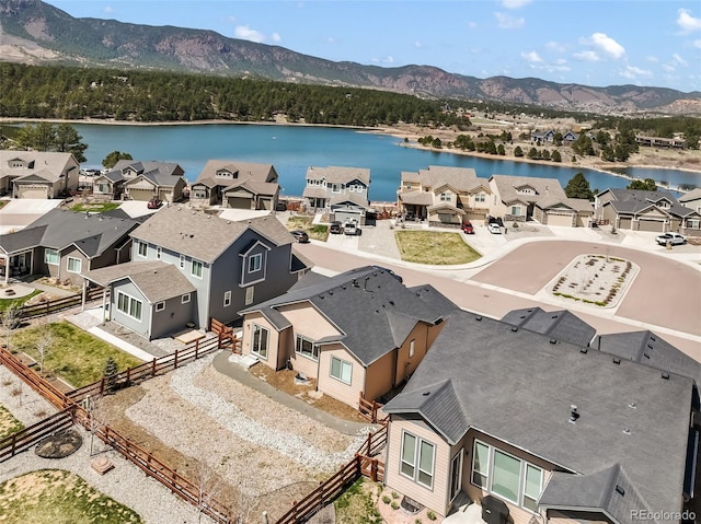 aerial view featuring a residential view and a water and mountain view