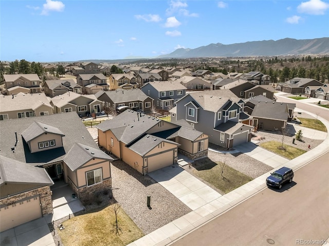 birds eye view of property with a mountain view and a residential view