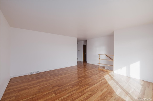 empty room featuring wood-type flooring