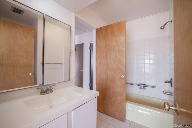 bathroom with bathing tub / shower combination, tile patterned flooring, and vanity