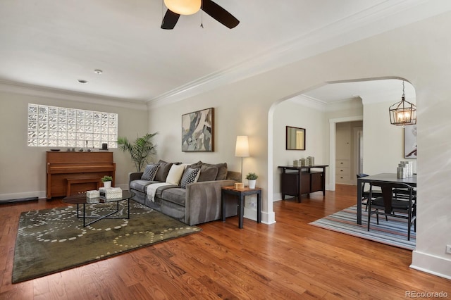 916 Adams St, Denver, CO 80206 - living area featuring arched walkways, ornamental molding, ceiling fan, wood finished floors, and baseboards