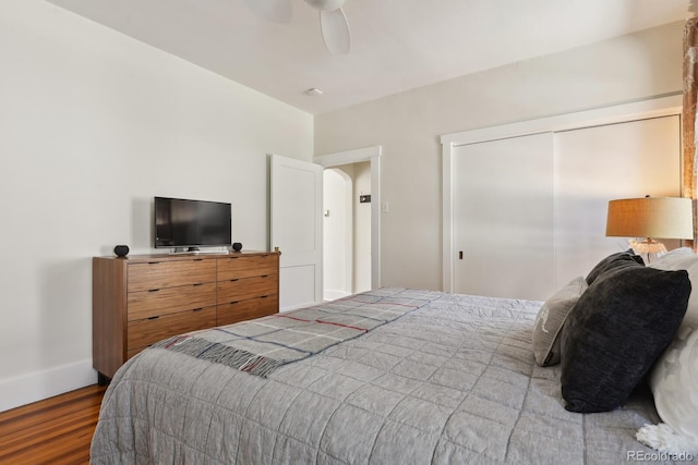 916 Adams St, Denver, CO 80206 - bedroom with wood finished floors, a closet, baseboards, and ceiling fan