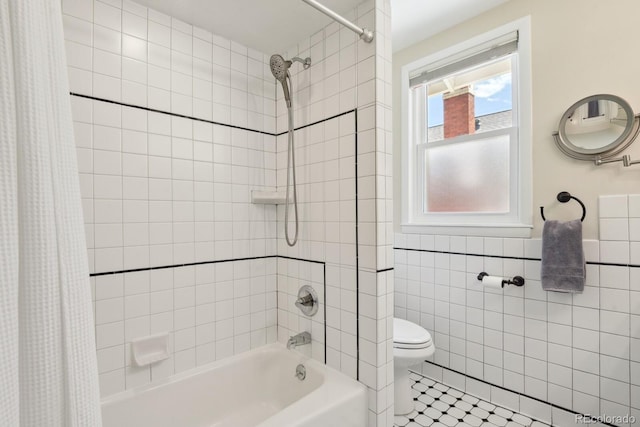 916 Adams St, Denver, CO 80206 - full bath with shower / bath combo, toilet, tile walls, and tile patterned flooring