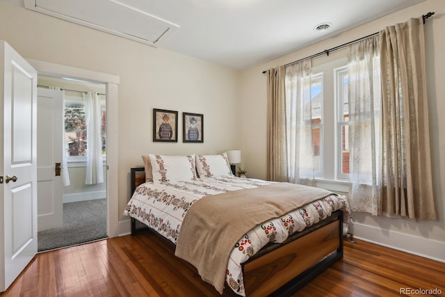 916 Adams St, Denver, CO 80206 - bedroom with multiple windows, hardwood / wood-style floors, and attic access