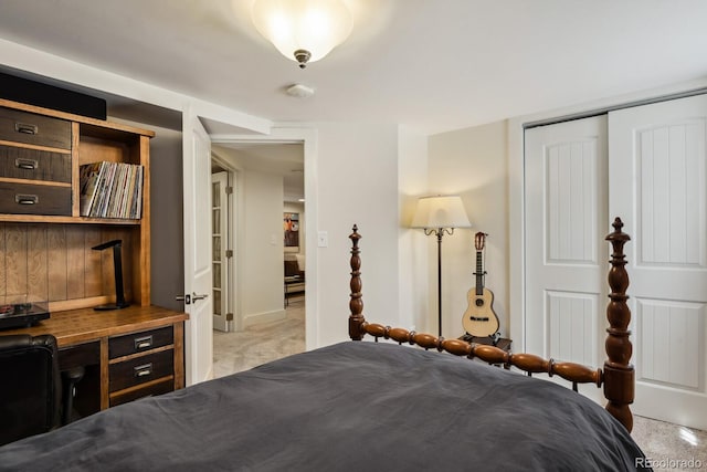 916 Adams St, Denver, CO 80206 - bedroom with light carpet, a closet, an office area, and baseboards