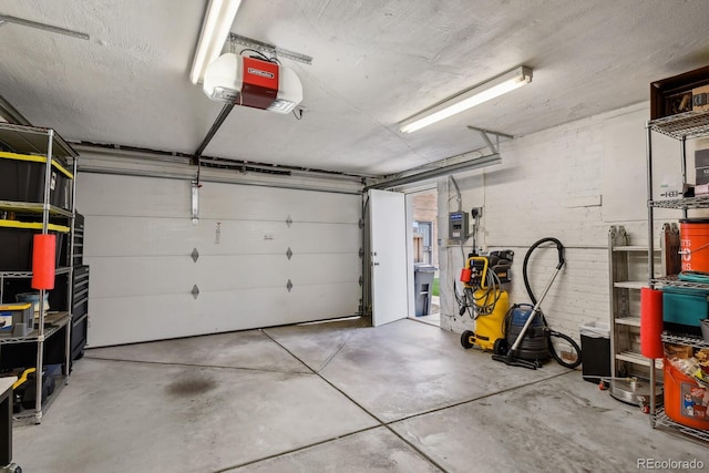 916 Adams St, Denver, CO 80206 - garage with a garage door opener and electric panel