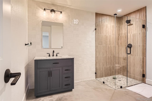 bathroom with vanity and a shower with shower door