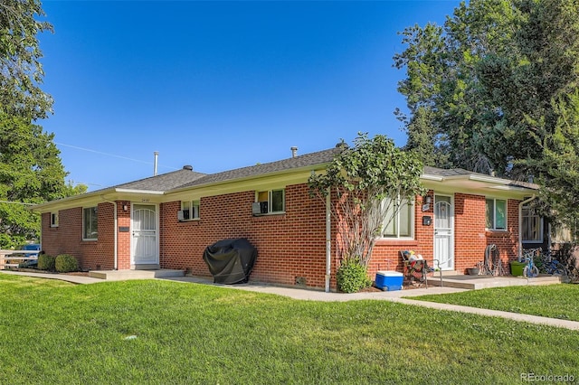2495 S Race St, Denver, CO 80210 - view of front of home with a front lawn and brick siding