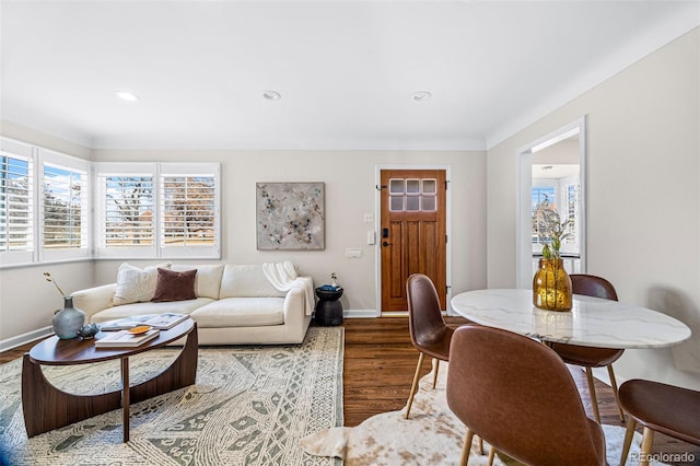 living room with baseboards, wood finished floors, and recessed lighting