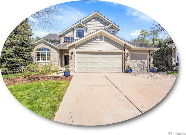 10388 Lions Path, Lone Tree, CO 80124 - traditional home featuring brick siding, concrete driveway, and an attached garage