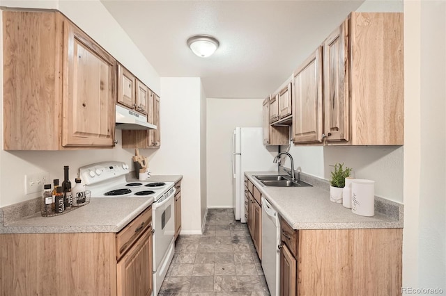 16259 W 10th Ave Unit K1, Golden, CO 80401 - kitchen with white appliances, under cabinet range hood, light countertops, and light brown cabinetry